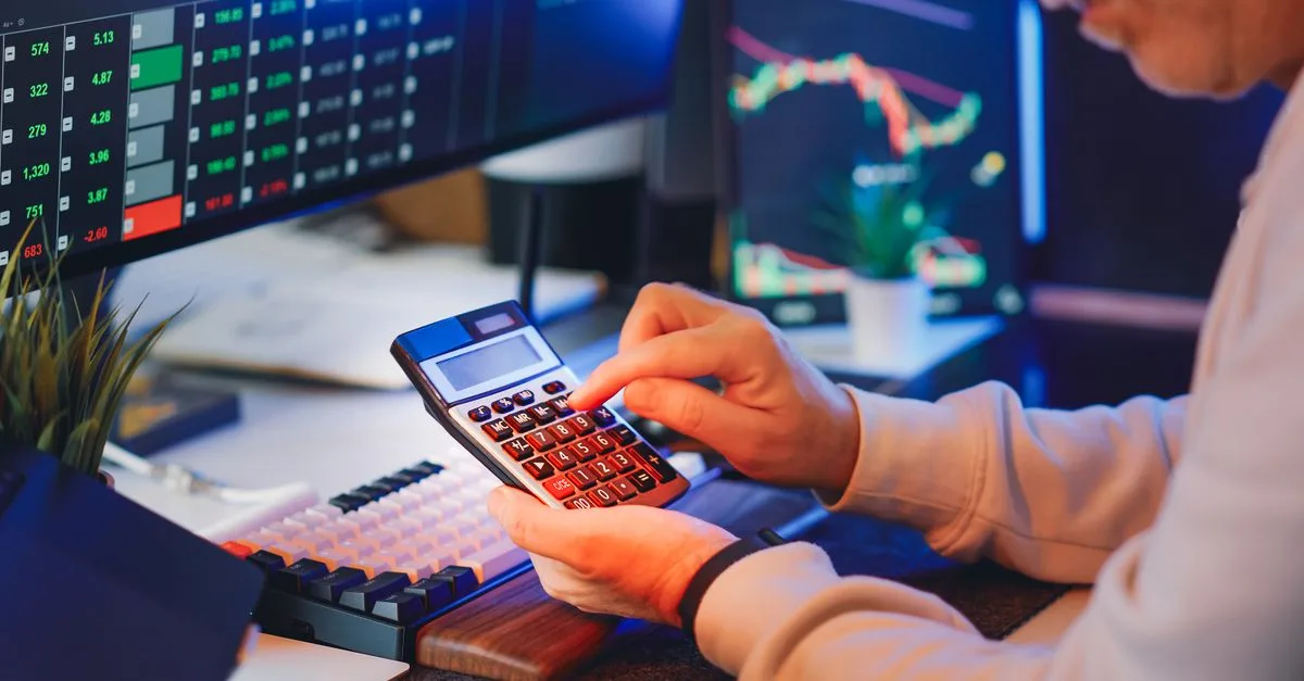 Professional analyzing business technology costs and ROI on a digital display